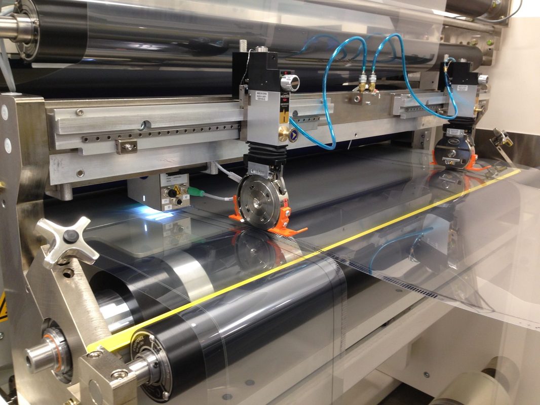 Optical-grade coated film from an IMC coating system