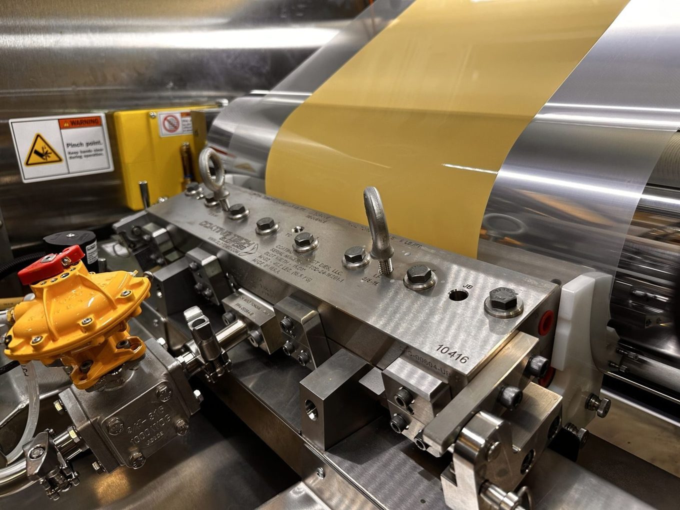 Slot die coating station on an IMC production coating line